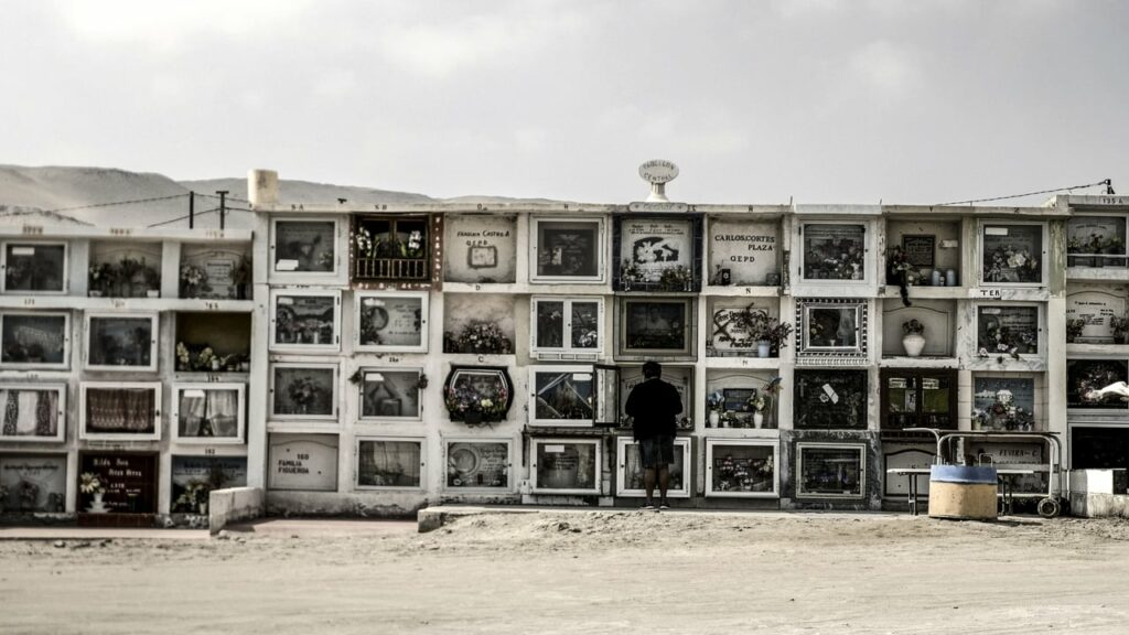 A photo taken from the documentary Arica, featuring a wall of cabinets with a person standing in the middle