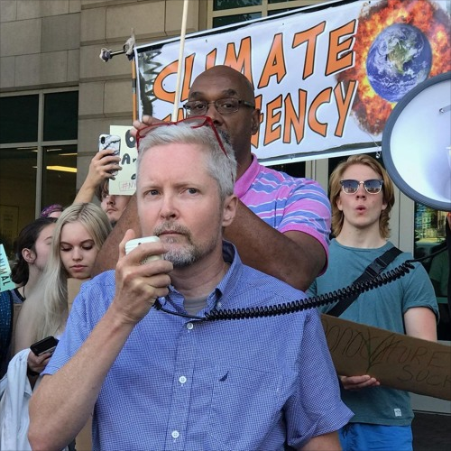 An action shot of Dave Publow at a protest