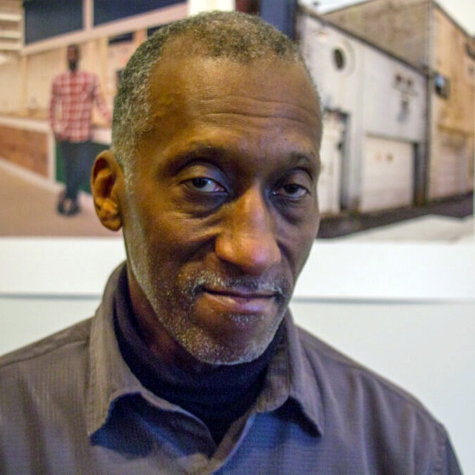 A headshot of Willie Terry, wearing a dark colored button up.