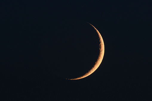 Moon in the night sky just after the New Moon during the waxing crescent towards becoming full again.
