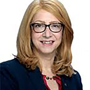 A headshot of Linda Rosenthal, who is wearing glasses and has medium-length blonde hair and is smiling for the camera.