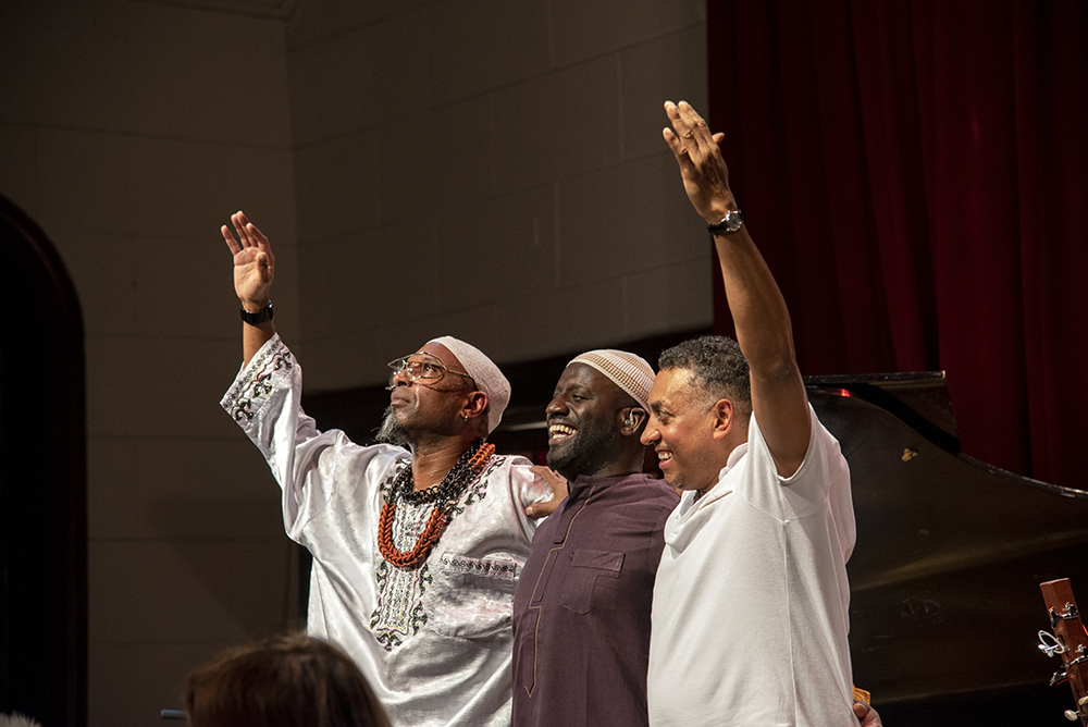 The SUBA trio standing to thank their audience and end their performance.